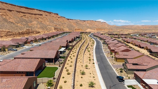 1398 Pin Cushion Rdg, Mesquite, NV 89034 - aerial perspective of suburban area featuring a mountain backdrop