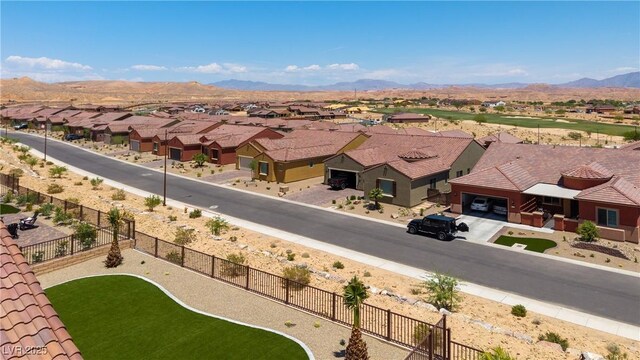 1398 Pin Cushion Rdg, Mesquite, NV 89034 - aerial perspective of suburban area featuring a mountain backdrop
