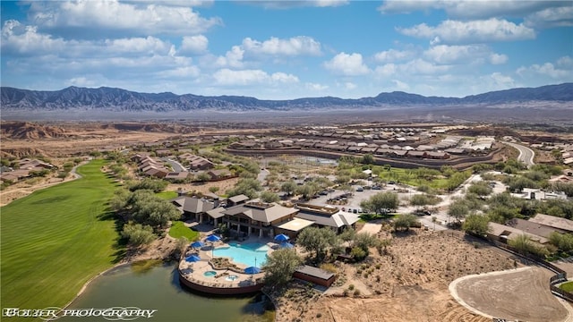 1398 Pin Cushion Rdg, Mesquite, NV 89034 - aerial view of residential area with a mountain backdrop and a local golf course