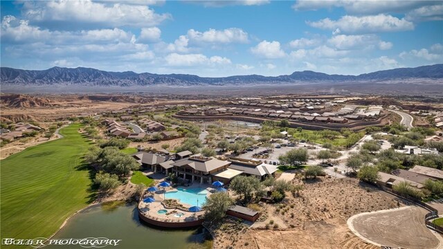 1398 Pin Cushion Rdg, Mesquite, NV 89034 - aerial view of residential area with a mountain backdrop and a local golf course