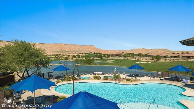1398 Pin Cushion Rdg, Mesquite, NV 89034 - community pool featuring a patio and a water and mountain view