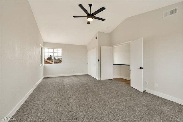 6388 Canyon Dawn Ave, Las Vegas, NV 89108 - unfurnished bedroom with dark carpet, vaulted ceiling, baseboards, and ceiling fan