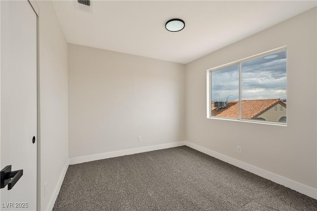 6388 Canyon Dawn Ave, Las Vegas, NV 89108 - empty room with dark colored carpet and baseboards