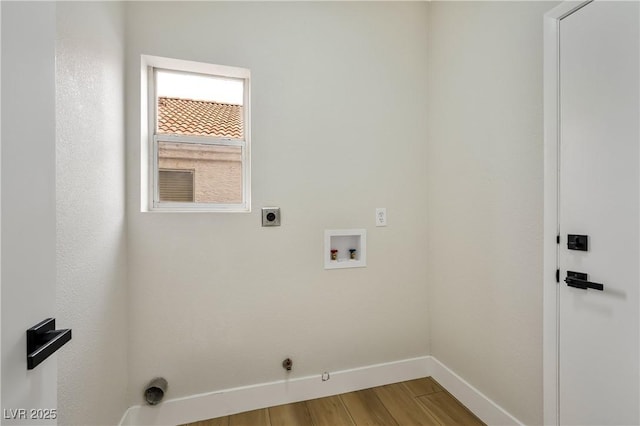 6388 Canyon Dawn Ave, Las Vegas, NV 89108 - laundry area with baseboards, washer hookup, hookup for an electric dryer, wood finished floors, and hookup for a gas dryer