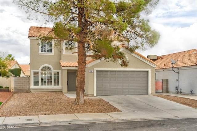 6388 Canyon Dawn Ave, Las Vegas, NV 89108 - mediterranean / spanish home featuring a tiled roof, driveway, stucco siding, and an attached garage