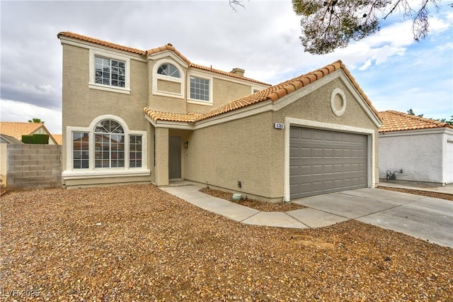 6388 Canyon Dawn Ave, Las Vegas, NV 89108 - mediterranean / spanish-style home featuring stucco siding, a garage, driveway, and a tiled roof
