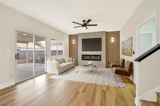 6388 Canyon Dawn Ave, Las Vegas, NV 89108 - living area with ceiling fan, wood finished floors, and a tiled fireplace