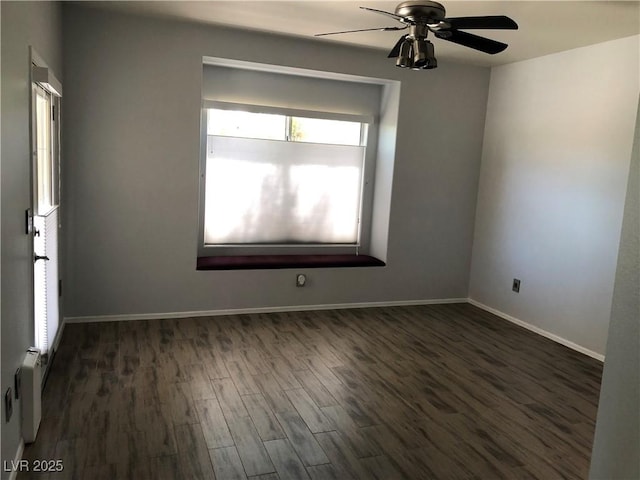 1396 Couperin Dr, Henderson, NV 89052 - unfurnished room with dark wood-style flooring, ceiling fan, and baseboards