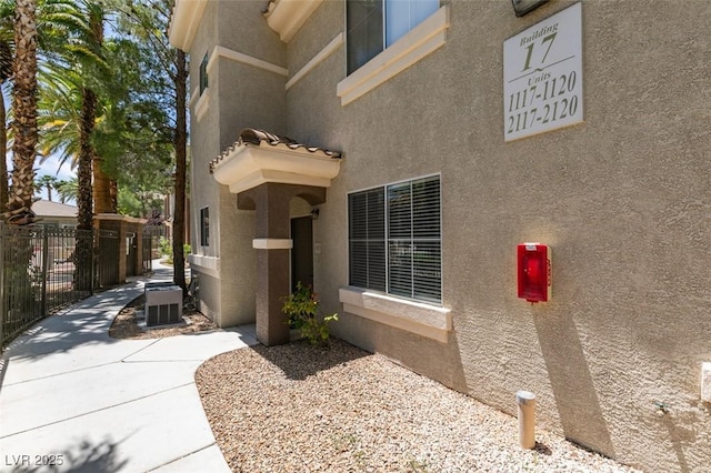 9050 W Warm Springs Rd Unit 1117, Las Vegas, NV 89148 - doorway to property with stucco siding