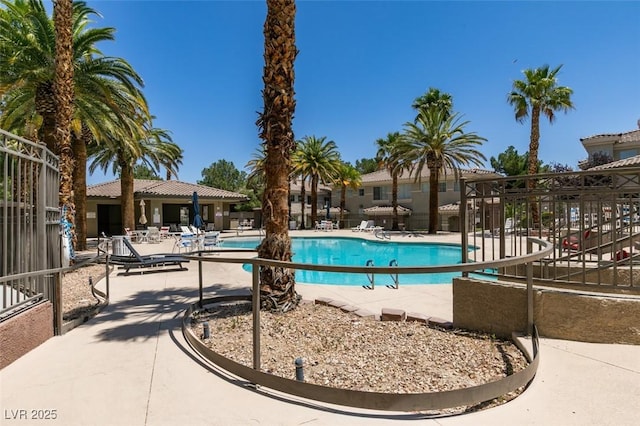 9050 W Warm Springs Rd Unit 1117, Las Vegas, NV 89148 - community pool featuring a patio area