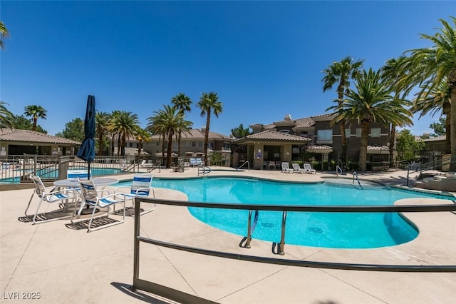9050 W Warm Springs Rd Unit 1117, Las Vegas, NV 89148 - community pool featuring a patio area