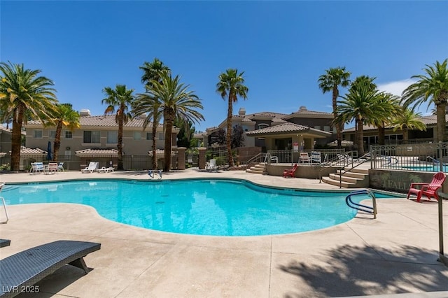 9050 W Warm Springs Rd Unit 1117, Las Vegas, NV 89148 - community pool featuring a patio area