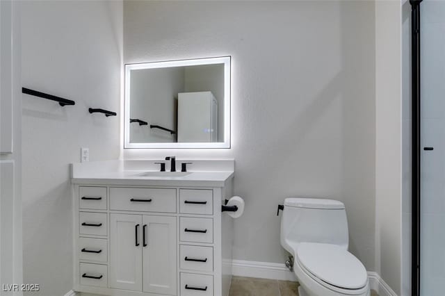 9050 W Warm Springs Rd Unit 1117, Las Vegas, NV 89148 - bathroom featuring vanity, baseboards, and toilet