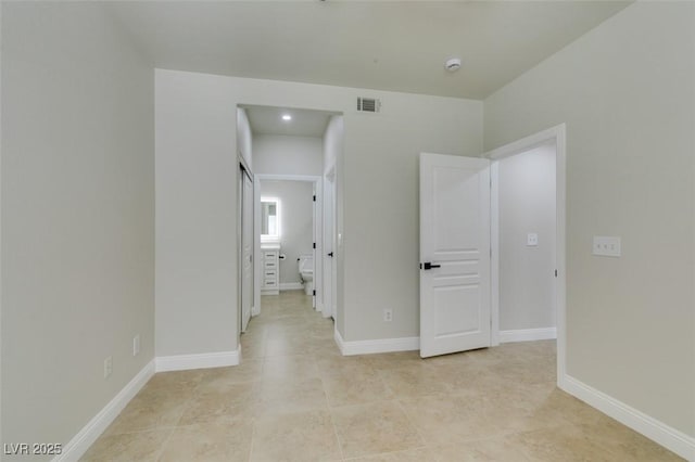 9050 W Warm Springs Rd Unit 1117, Las Vegas, NV 89148 - unfurnished bedroom with light tile patterned flooring and baseboards