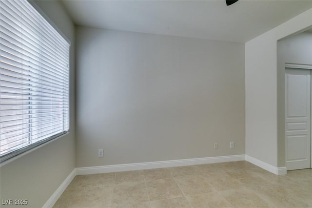 9050 W Warm Springs Rd Unit 1117, Las Vegas, NV 89148 - unfurnished room featuring ceiling fan, baseboards, and light tile patterned floors