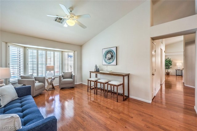 8428 Apple Hill Ct, Las Vegas, NV 89128 - living area featuring high vaulted ceiling, healthy amount of natural light, wood finished floors, and a ceiling fan