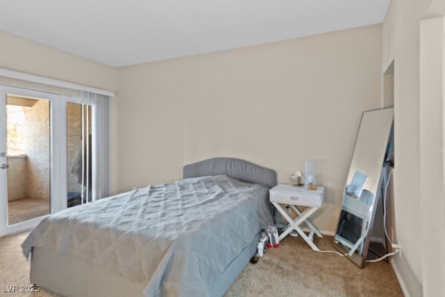 2643 Red Rock St Unit 201, Las Vegas, NV 89146 - bedroom with carpet flooring, baseboards, and access to exterior