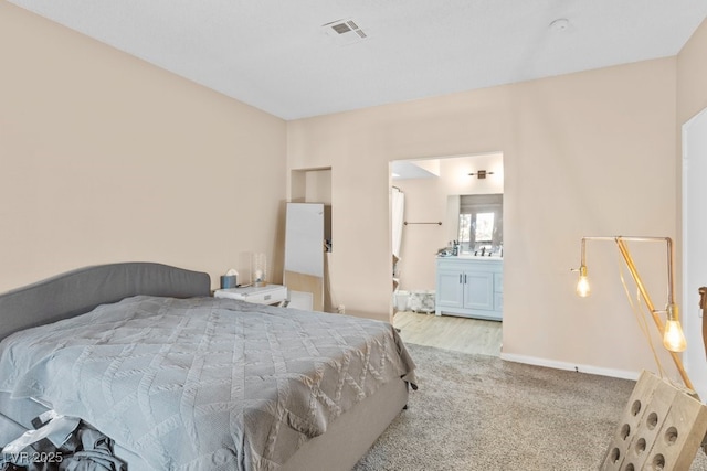 2643 Red Rock St Unit 201, Las Vegas, NV 89146 - bedroom featuring carpet, ensuite bath, and baseboards