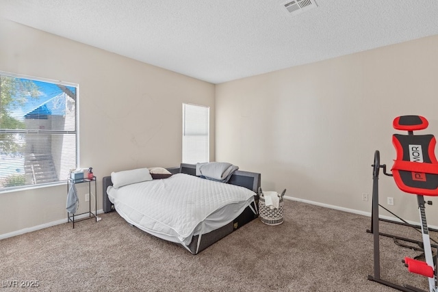 2643 Red Rock St Unit 201, Las Vegas, NV 89146 - carpeted bedroom with a textured ceiling and baseboards