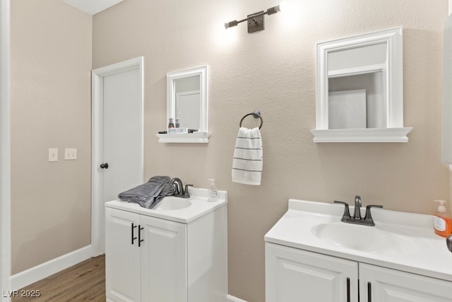 2643 Red Rock St Unit 201, Las Vegas, NV 89146 - bathroom with vanity, wood finished floors, and baseboards