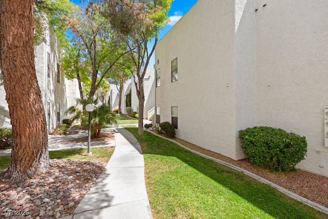 2643 Red Rock St Unit 201, Las Vegas, NV 89146 - view of community with a lawn