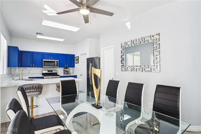 7925 Limbwood Ct, Las Vegas, NV 89131 - dining room featuring a ceiling fan and a skylight