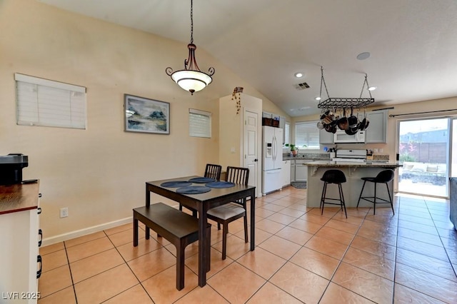 3823 Aspen Creek Ave, North Las Vegas, NV 89031 - dining space featuring light tile patterned flooring, lofted ceiling, a chandelier, recessed lighting, and baseboards