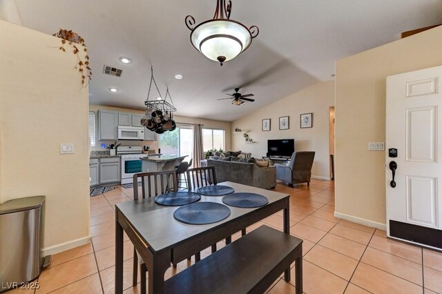 3823 Aspen Creek Ave, North Las Vegas, NV 89031 - dining room featuring light tile patterned flooring, vaulted ceiling, a ceiling fan, baseboards, and recessed lighting