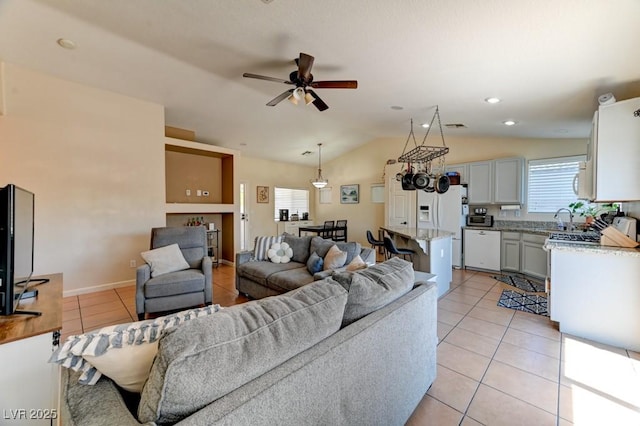 3823 Aspen Creek Ave, North Las Vegas, NV 89031 - living area with light tile patterned floors, lofted ceiling, and ceiling fan