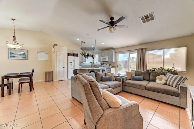3823 Aspen Creek Ave, North Las Vegas, NV 89031 - living room with light tile patterned floors, ceiling fan, and lofted ceiling