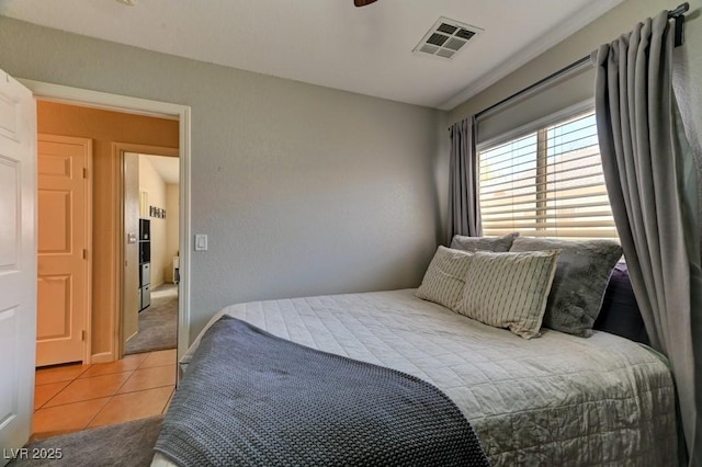 3823 Aspen Creek Ave, North Las Vegas, NV 89031 - bedroom featuring light tile patterned floors and light carpet