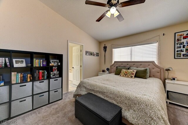 3823 Aspen Creek Ave, North Las Vegas, NV 89031 - bedroom with carpet, vaulted ceiling, connected bathroom, and a ceiling fan