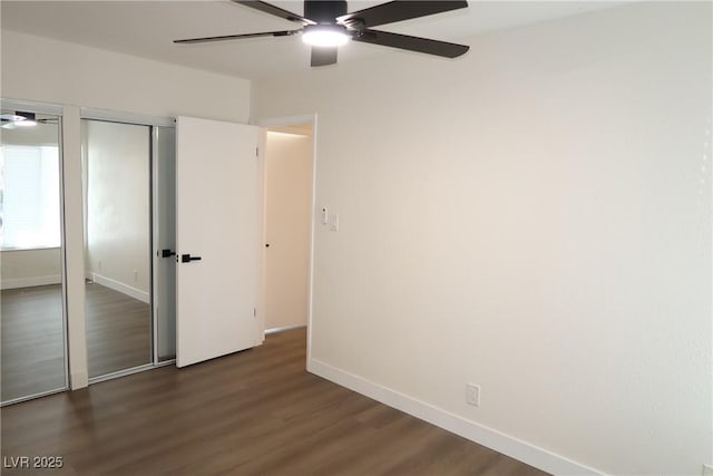 404 Vassar Ln, Las Vegas, NV 89107 - unfurnished bedroom featuring dark wood-style floors, baseboards, and a ceiling fan