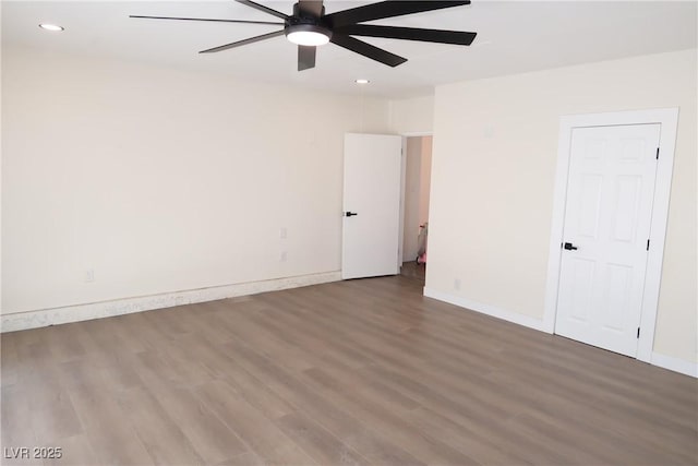 404 Vassar Ln, Las Vegas, NV 89107 - unfurnished bedroom with wood finished floors, recessed lighting, baseboards, and ceiling fan