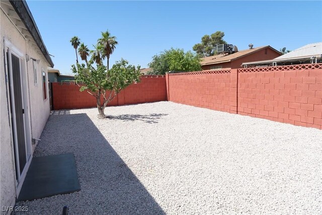 404 Vassar Ln, Las Vegas, NV 89107 - fenced backyard with a patio area and central air condition unit