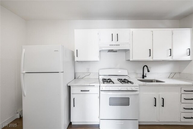 404 Vassar Ln, Las Vegas, NV 89107 - kitchen with white appliances, a sink, under cabinet range hood, and white cabinets
