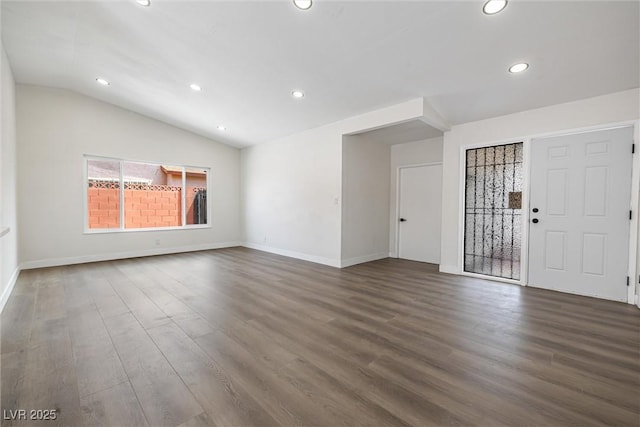 404 Vassar Ln, Las Vegas, NV 89107 - empty room with dark wood finished floors, recessed lighting, vaulted ceiling, and baseboards