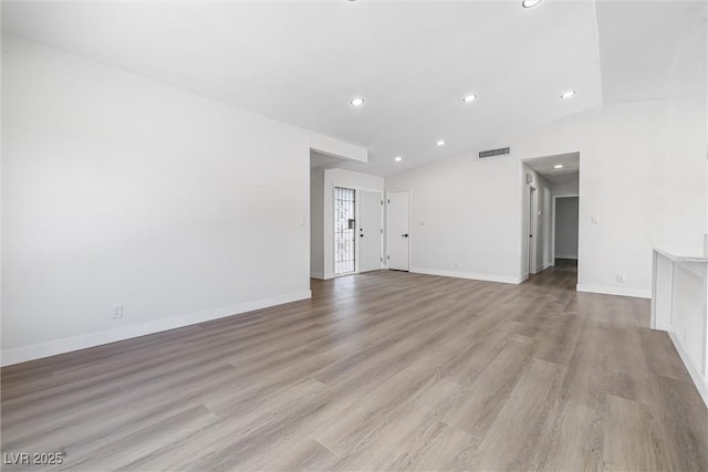 404 Vassar Ln, Las Vegas, NV 89107 - unfurnished living room with recessed lighting, light wood-style floors, and baseboards