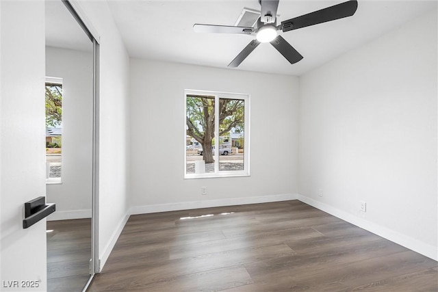 404 Vassar Ln, Las Vegas, NV 89107 - unfurnished room with wood finished floors, ceiling fan, and baseboards