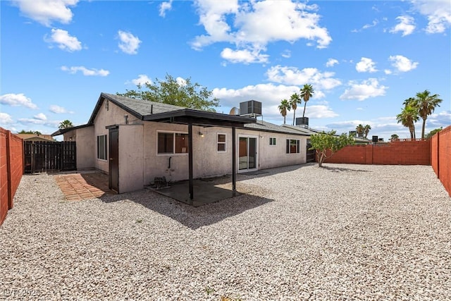 404 Vassar Ln, Las Vegas, NV 89107 - back of property with a fenced backyard, a patio, central air condition unit, and stucco siding