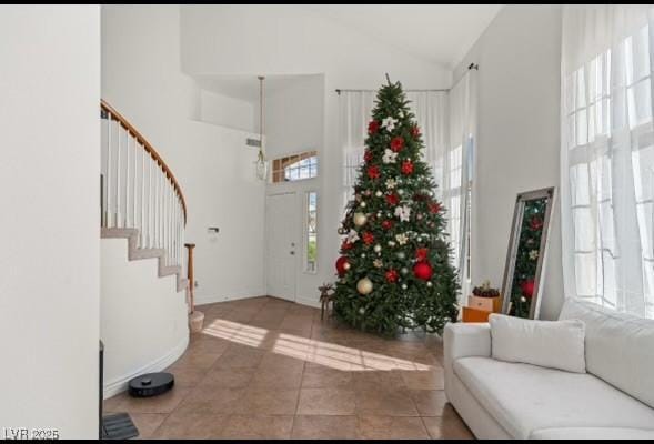 59 Desert Dawn Ln, Henderson, NV 89074 - entrance foyer with high vaulted ceiling, stairway, and light tile patterned floors