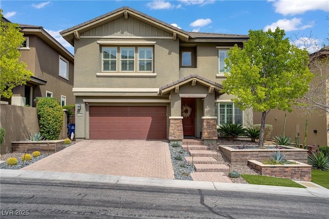5742 Shadow Bend Dr, Las Vegas, NV 89135 - view of front of property with stucco siding, a garage, stone siding, decorative driveway, and a tiled roof