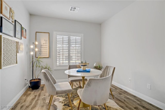 5742 Shadow Bend Dr, Las Vegas, NV 89135 - dining space featuring light wood-style floors and baseboards