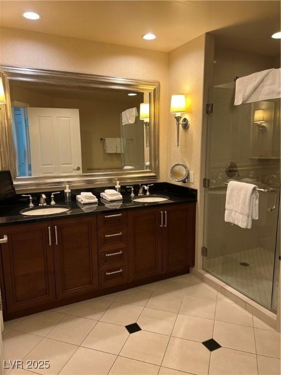 125 E Harmon Ave Unit 2918, Las Vegas, NV 89109 - bathroom with double vanity, a shower stall, tile patterned floors, and recessed lighting