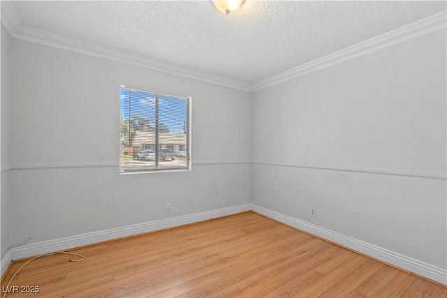 5101 Churchill Ave, Las Vegas, NV 89107 - unfurnished room featuring light wood-style floors, a textured ceiling, baseboards, and ornamental molding