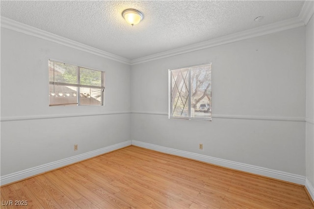 5101 Churchill Ave, Las Vegas, NV 89107 - empty room with light wood-style floors, a textured ceiling, crown molding, and baseboards