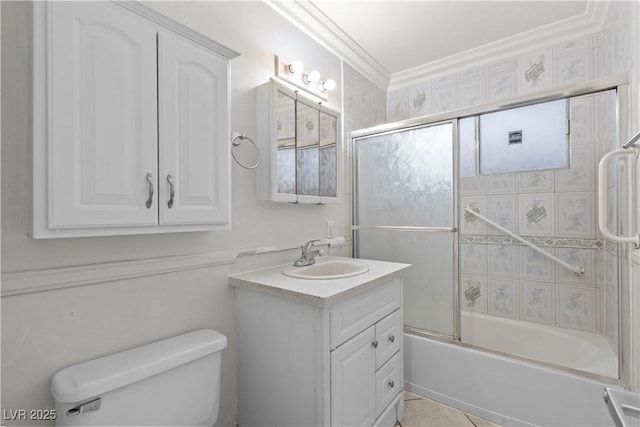 5101 Churchill Ave, Las Vegas, NV 89107 - full bath featuring toilet, vanity, combined bath / shower with glass door, ornamental molding, and tile patterned flooring