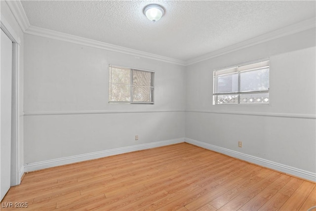 5101 Churchill Ave, Las Vegas, NV 89107 - unfurnished bedroom with a textured ceiling, wood finished floors, ornamental molding, baseboards, and a closet