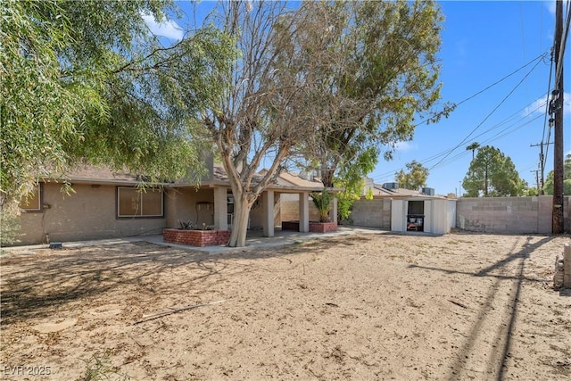 5101 Churchill Ave, Las Vegas, NV 89107 - back of property featuring a fenced backyard and a patio