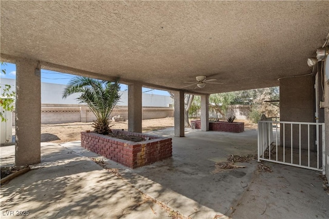5101 Churchill Ave, Las Vegas, NV 89107 - fenced backyard with a ceiling fan and a patio area